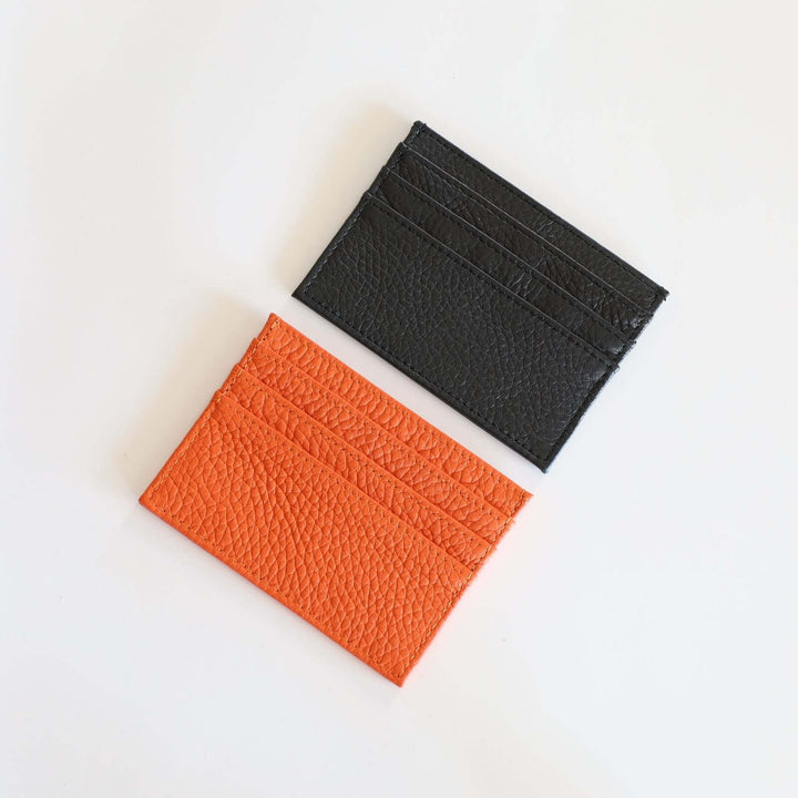 The card holders are offered in black and orange.