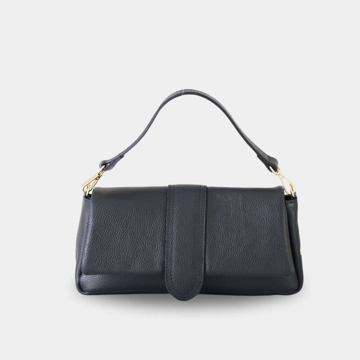 Black pebbled leather handbag with a front flap closure and a top handle attached with gold-tone hardware. Front view.