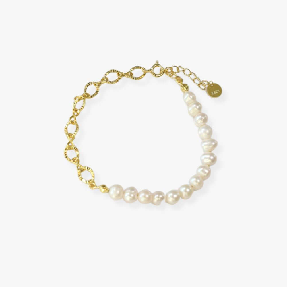 Gold plated split bracelet  with white freshwater pearls in one side and a chain with large links on the other side. 