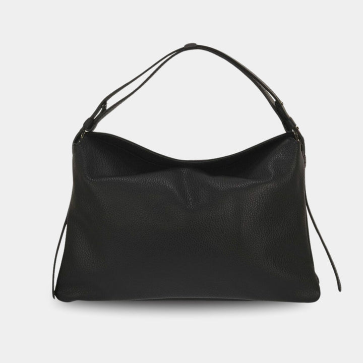 Black pebbled leather top handle bag with a detachable shoulder strap. Back view.