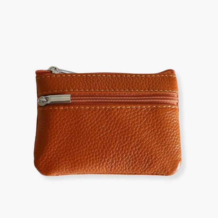 Small tan leather double zipper wallet with an embedded gray metal keychain. The wallet is shown closed.