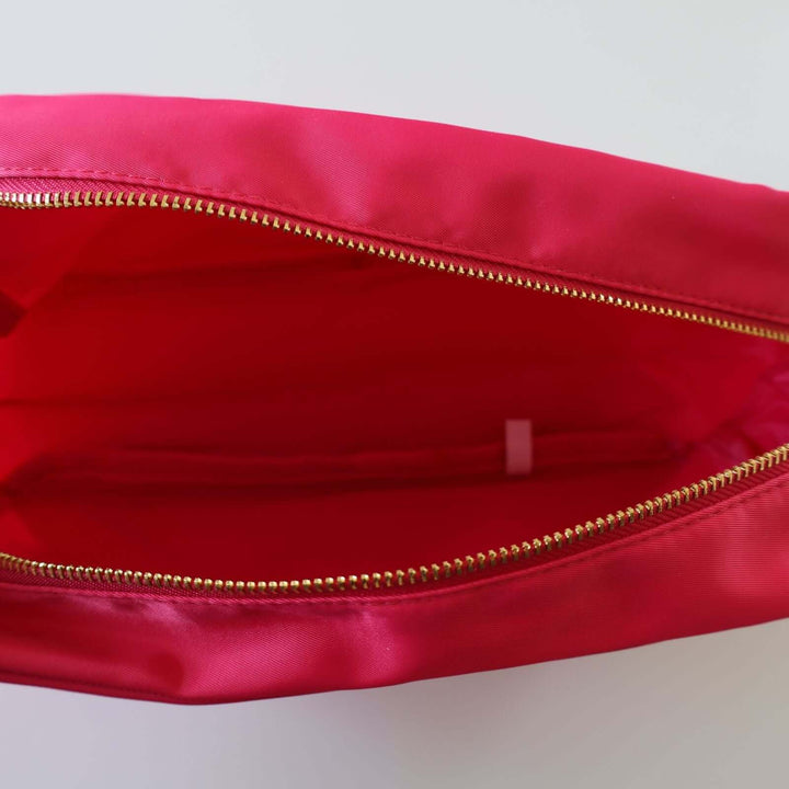 Inside a pink toiletry bag.