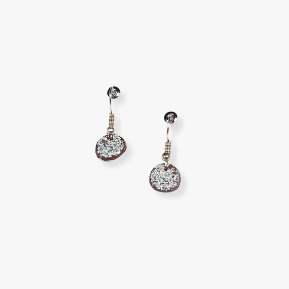 Round brown pendant earrings with glitter hanging from a metal hook.