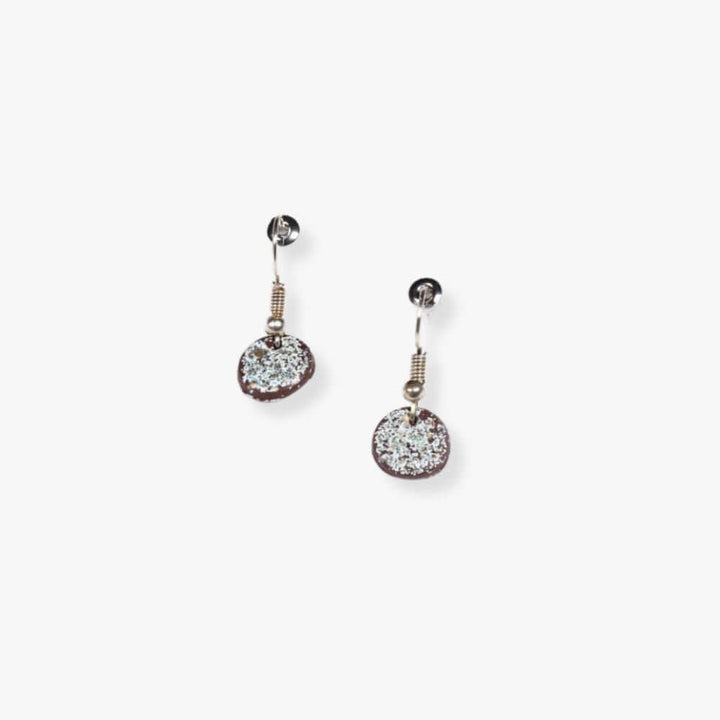 Round brown pendant earrings with glitter hanging from a metal hook.