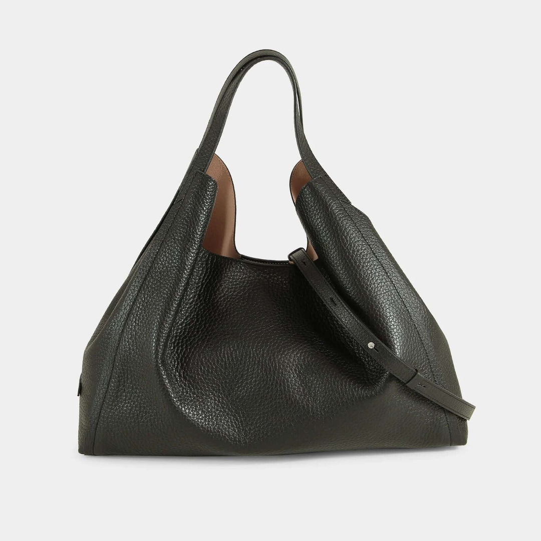 Dual-toned tote bag with a combination of black and brown leather and a detachable shoulder strap. Front view.