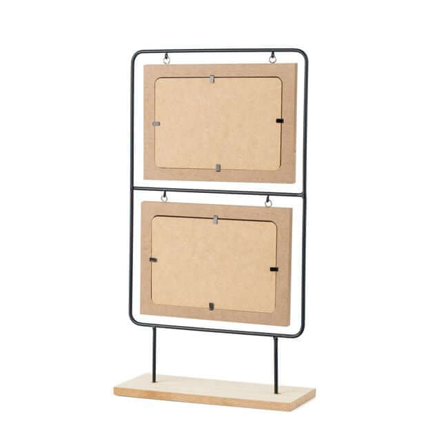 Double picture frames in a wood and black metal stand: back view.