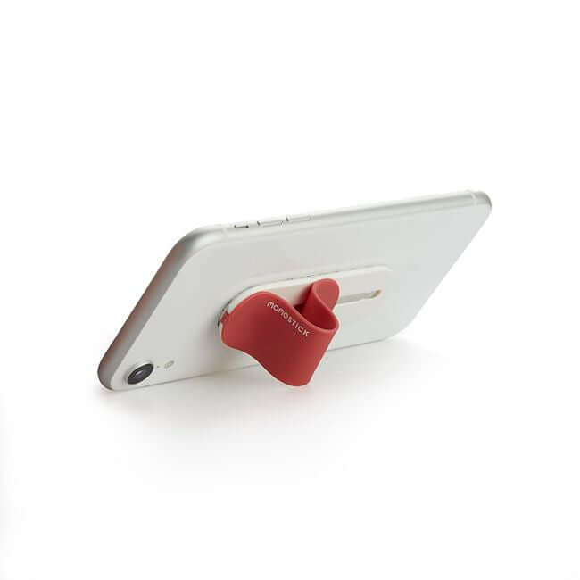 Red phone grip holder used a stand for a phone.