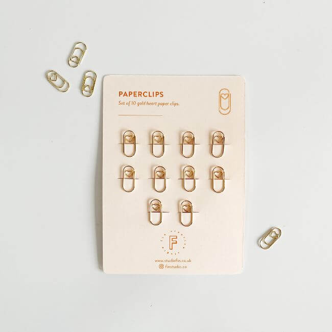 Set of paper clips with a small heart pattern.