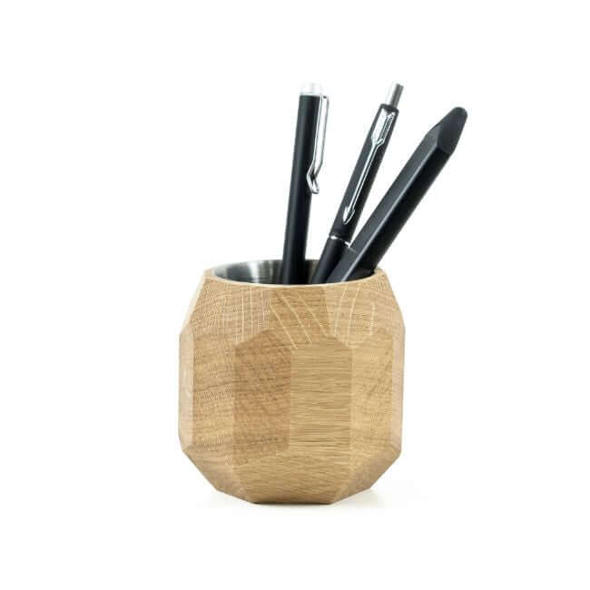 Three black pens in an oak pen holder.