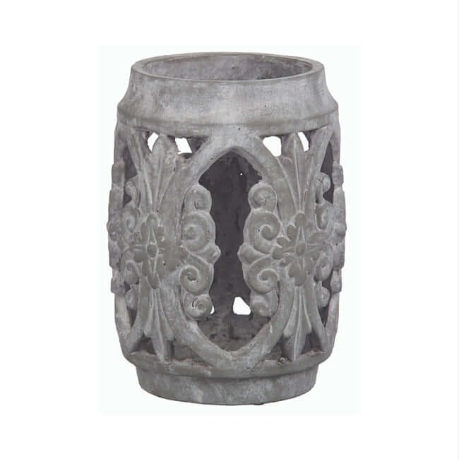 Unglazed gray terracotta hurricane with ornaments.