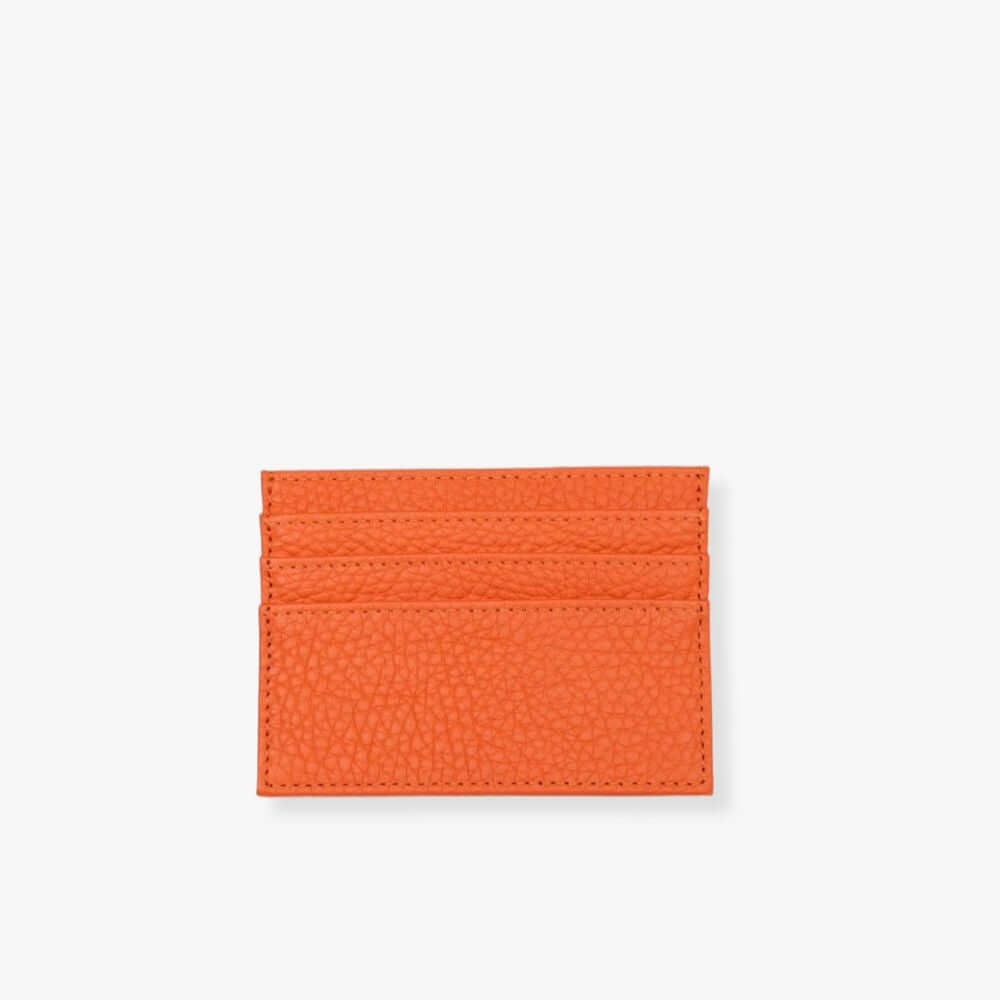 Orange leather card holder with 3 slots on each side.
