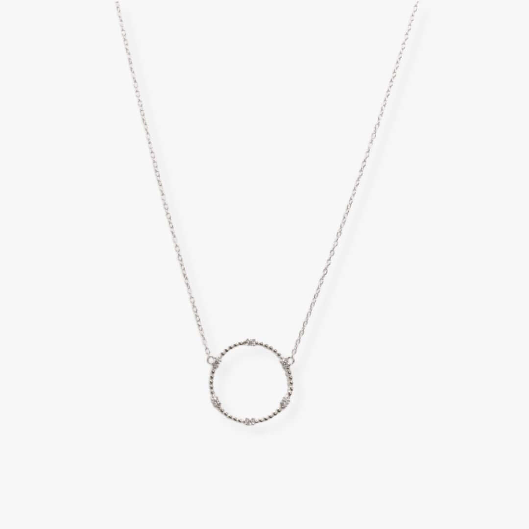 Textured 2 cm silver circle suspended from a silver dainty chain
