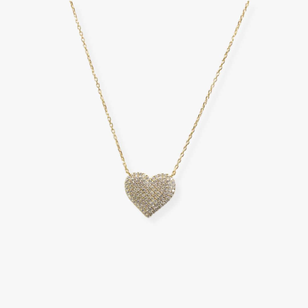Golden necklace with a heart-shaped pendant set with cubic zirconia.