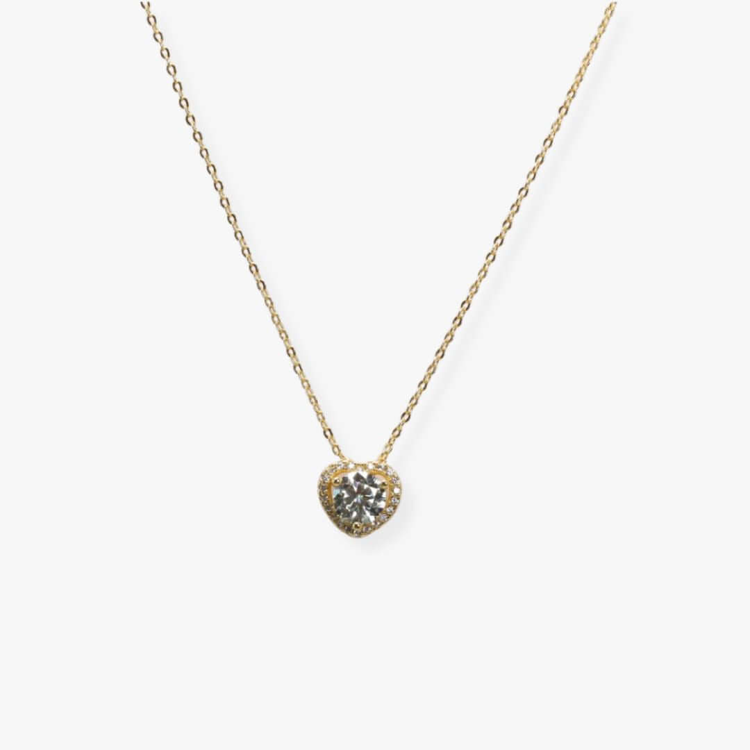 Golden necklace with a heart shaped pendant set with a synthetic diamond.