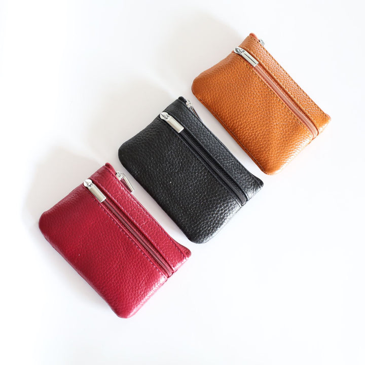 The keychain wallet is offered in black, tan, and red.