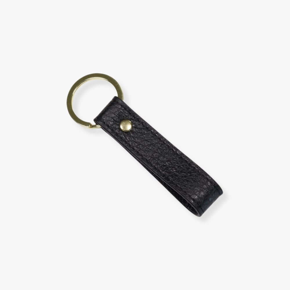Loop key fob with a black pebbled leather strap and a golden ring.