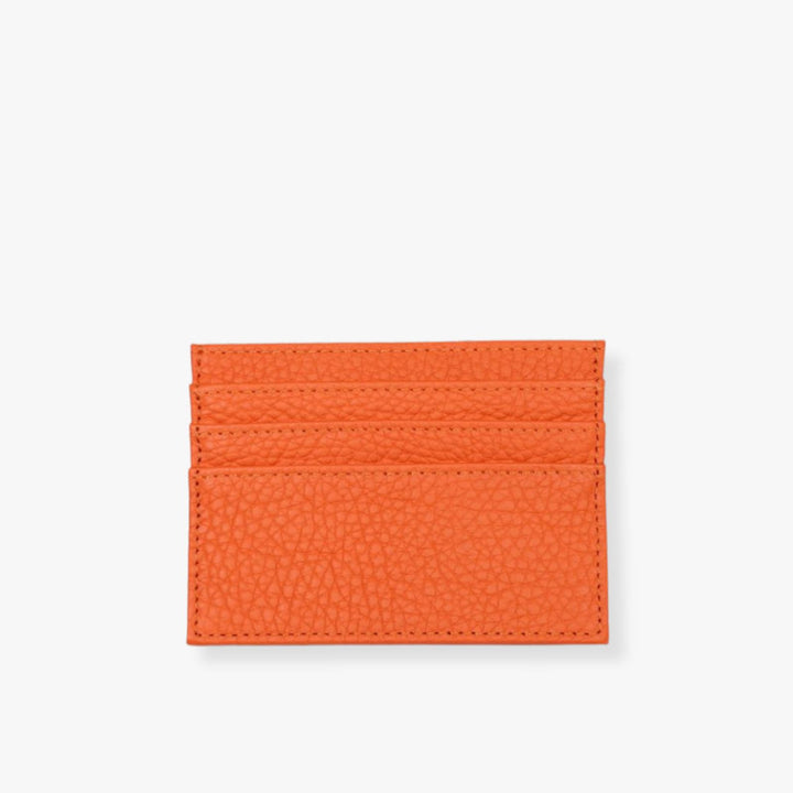 Orange leather card holder with 3 slots on each side.