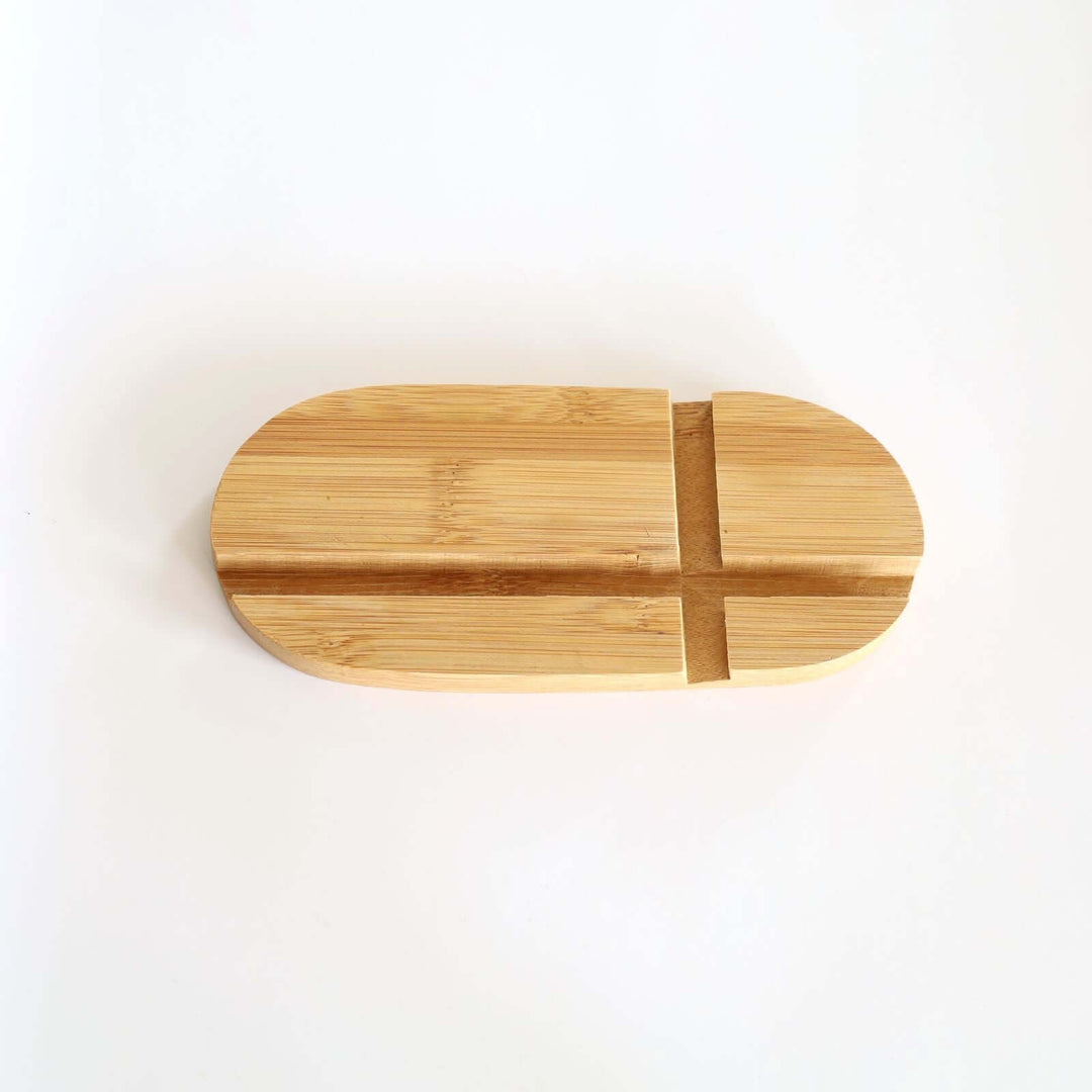 Oval phone and tablet holder made from bamboo.