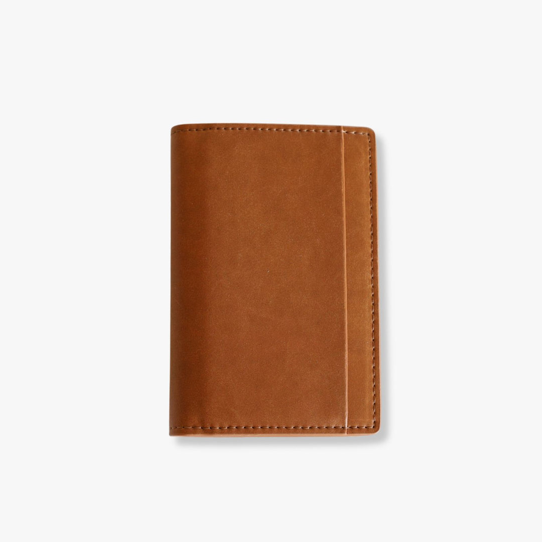 Pop up tan leather wallet with a front pocket.