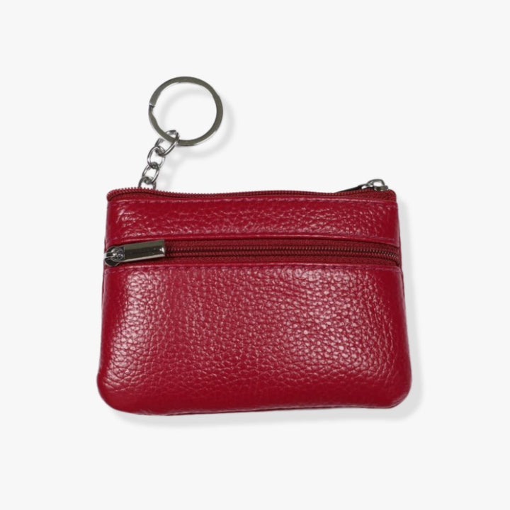 Small red leather double zipper wallet with an embedded gray metal keychain