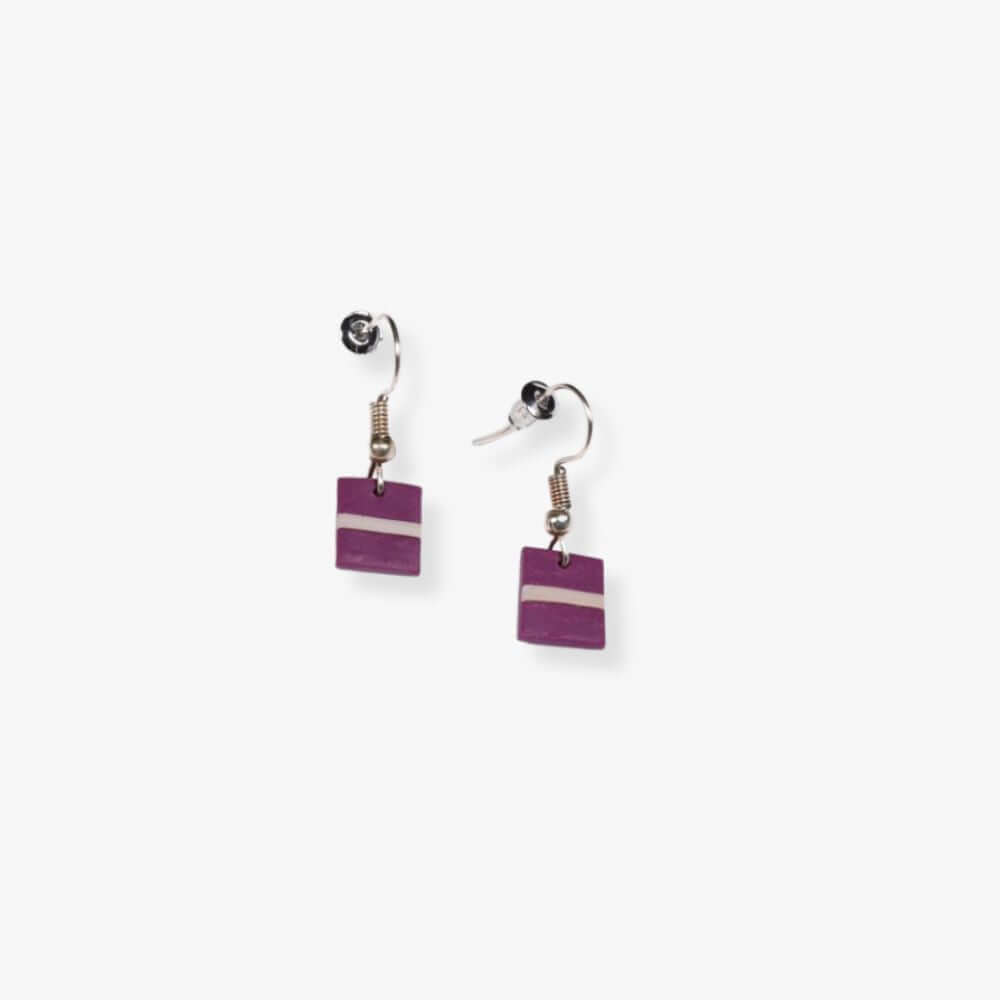 Square violet pendant earrings with a stripe in the middle hanging from a metal hook.