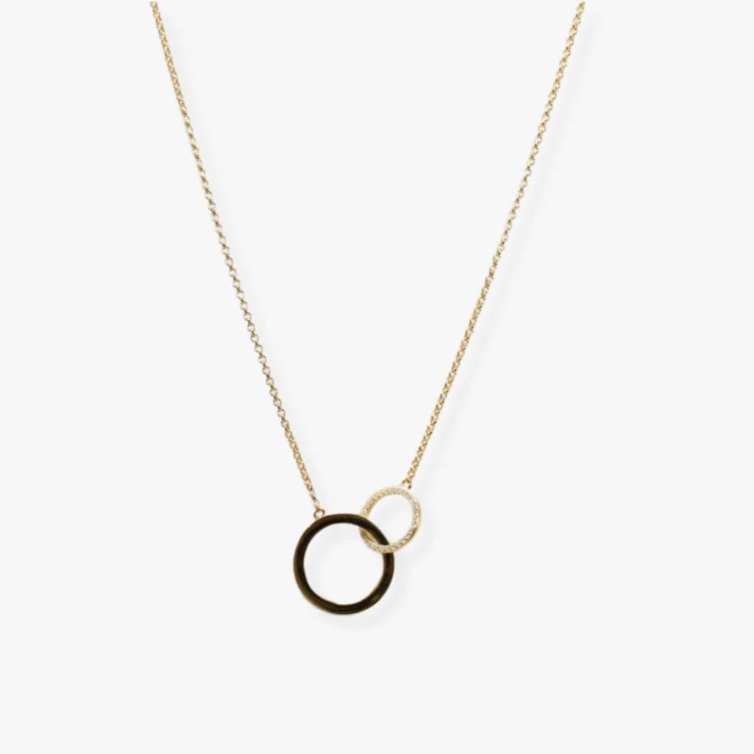 Two interlocking gold plated circles of different sizes suspended from a golden dainty chain.