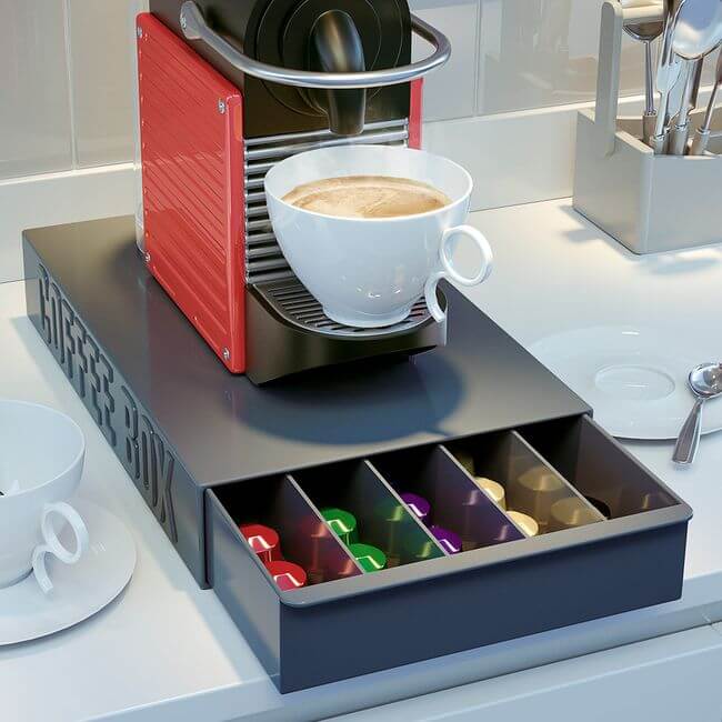 Coffee pod storage drawer with five rows: view with the photo of a coffee machine on top of it.