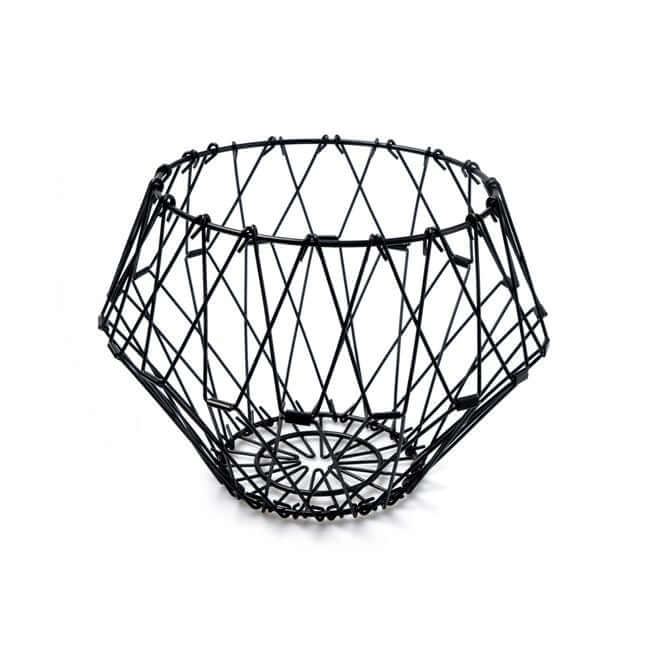 Flexible black wire fruit basket shaped like a bowl.