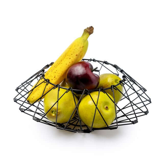 Flexible black wire fruit basket shaped like a bread basket: view with fruits.