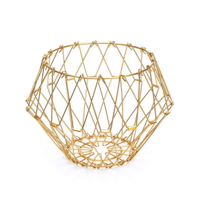 Flexible gold wire fruit basket shaped like a bowl.