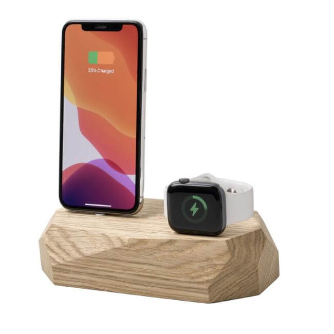 Oak charging dock with an Apple iPhone and a white Apple Watch.