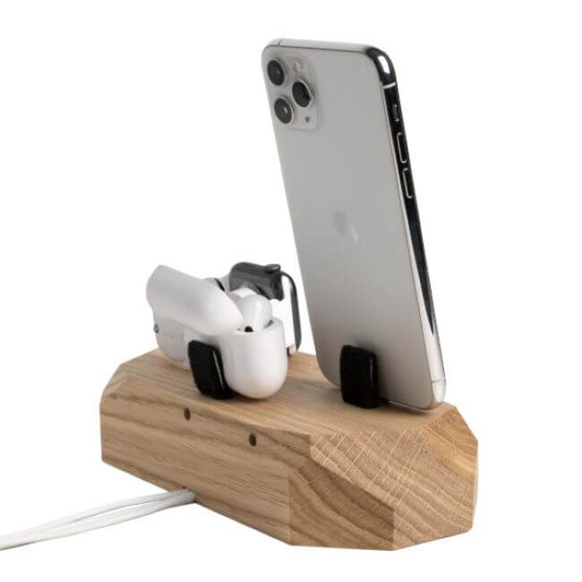 Back view of an oak charging station with an iPhone on the right, a white Apple® Watch on the left and Airpods in a white case in the middle.