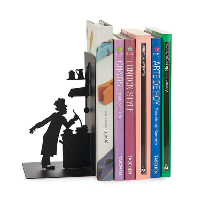Black metal bookend with a cut out representing a cook: view with books.