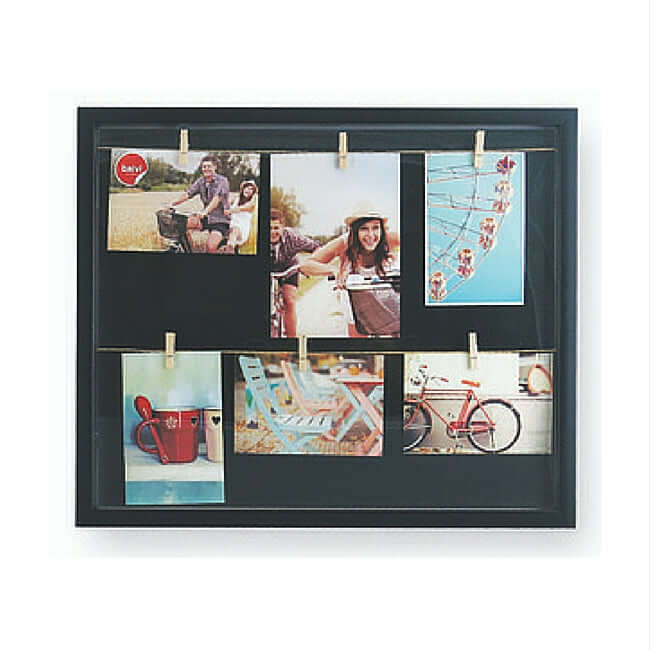 Black photo display with a clothesline and 6 wooden clips to hold photos.