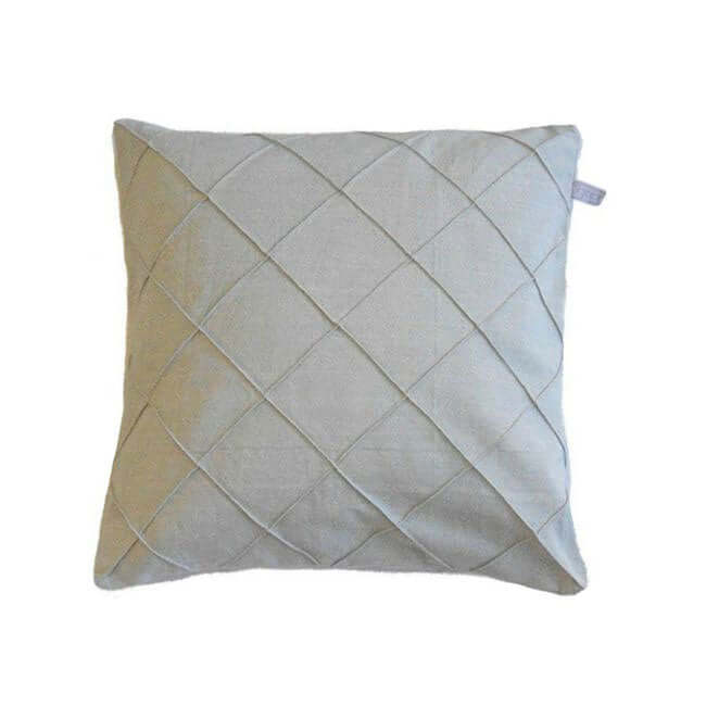 Green fabric throw pillow with a diamond lattice design.