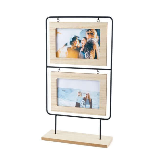 Double picture frames in a wood and black metal stand, with photos.