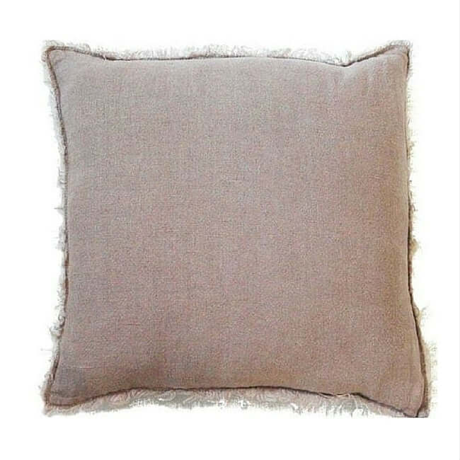 Pink linen throw pillow with fringe.