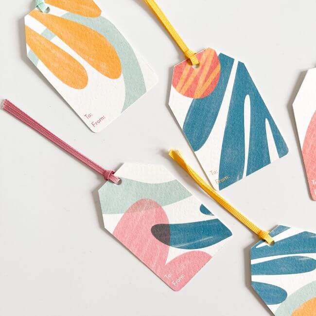 Different gift tags with colorful ribbons.