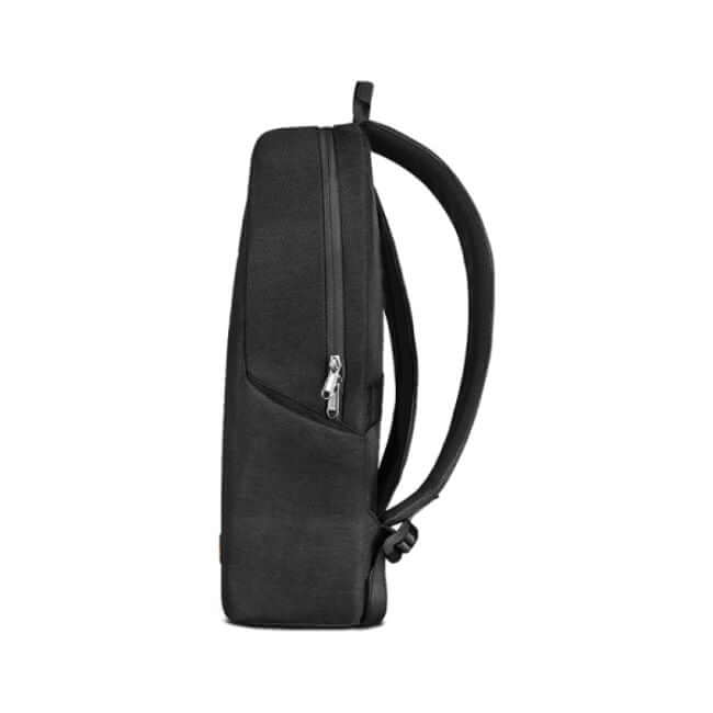 Black laptop backpack with padded straps. Side view.