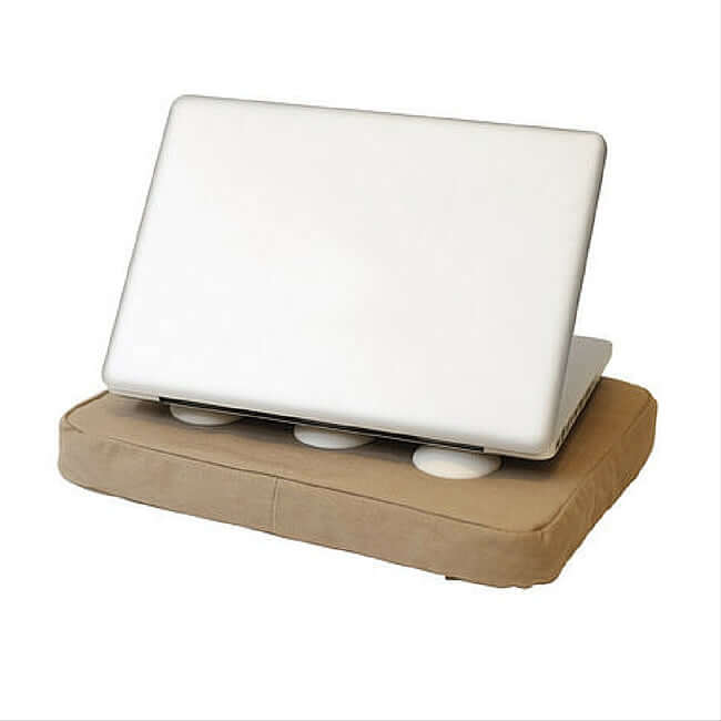 Beige laptop cushion with 6 silicone pads that prevent the laptop from overheating, with a laptop on top of it.