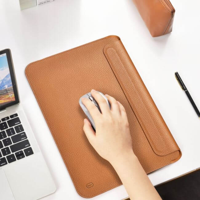 Brown leather sleeve for MacBook Pro 13" used as a mouse pad.