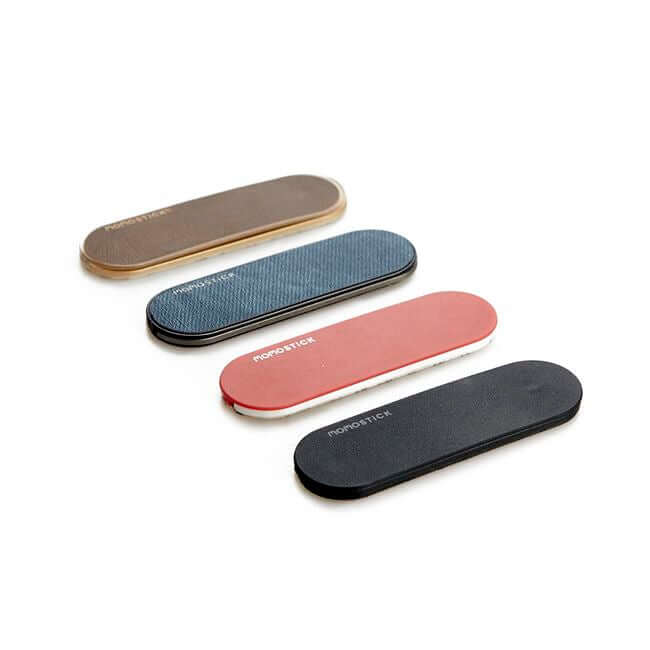 Set of 4 phone grip holders: red, brown, blue and black.