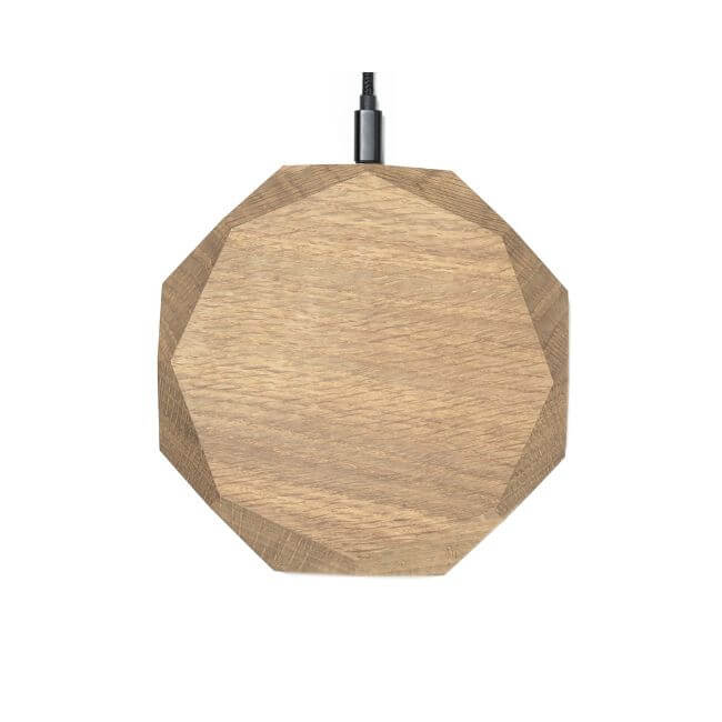 Wireless phone charger made from oak with a geometric design.