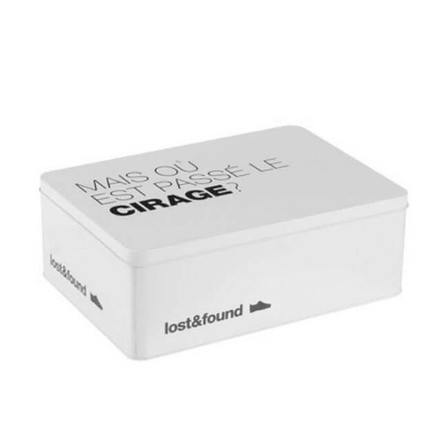 White tin storage box for storing shoe care and accessories, with the text "mais où est passé le cirage?"