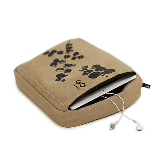 Beige tablet cushion with pockets for holding and storing the tablet.