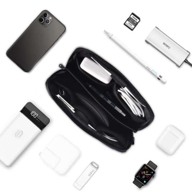 Black tech organizer bag holding tech accessories, shown on a desktop together with several tech accessories, such as a smartphone, a dock station, a smartwatch, a power bank, a stylus, a memory card, a USB key, and an adapter.