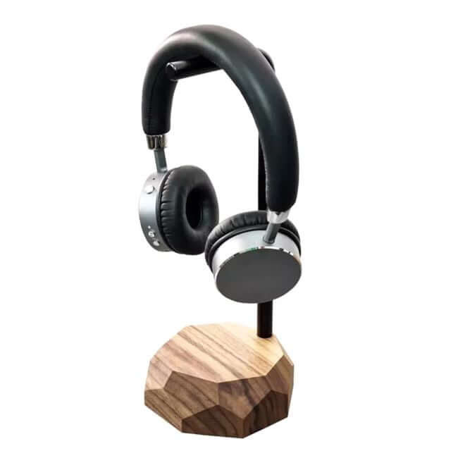 Black metal headphone stand with a walnut base.